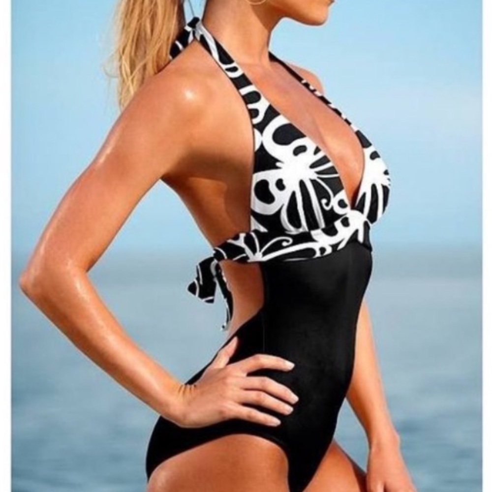 New without tags, black and white halter style one piece from Venus sz 8